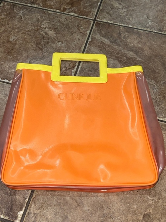 Clinique Handbags - Clinique Bright Orange Tote with Yellow Trim Bag LIKE NEW